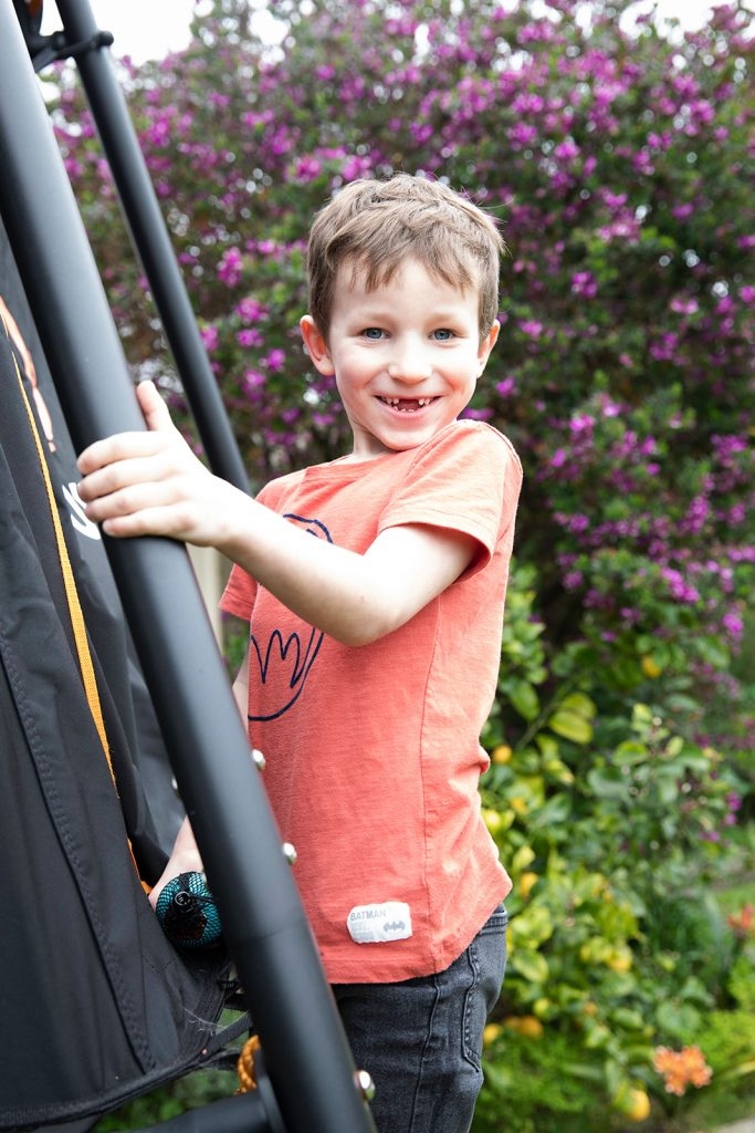 Child holding on railing